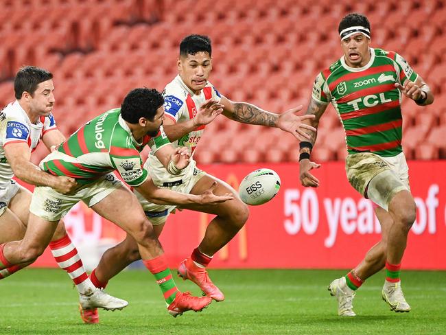 Cody Walker of the Rabbitohs offloads to Dane Gagai. Picture: Handout/NRL Photos via Getty Images