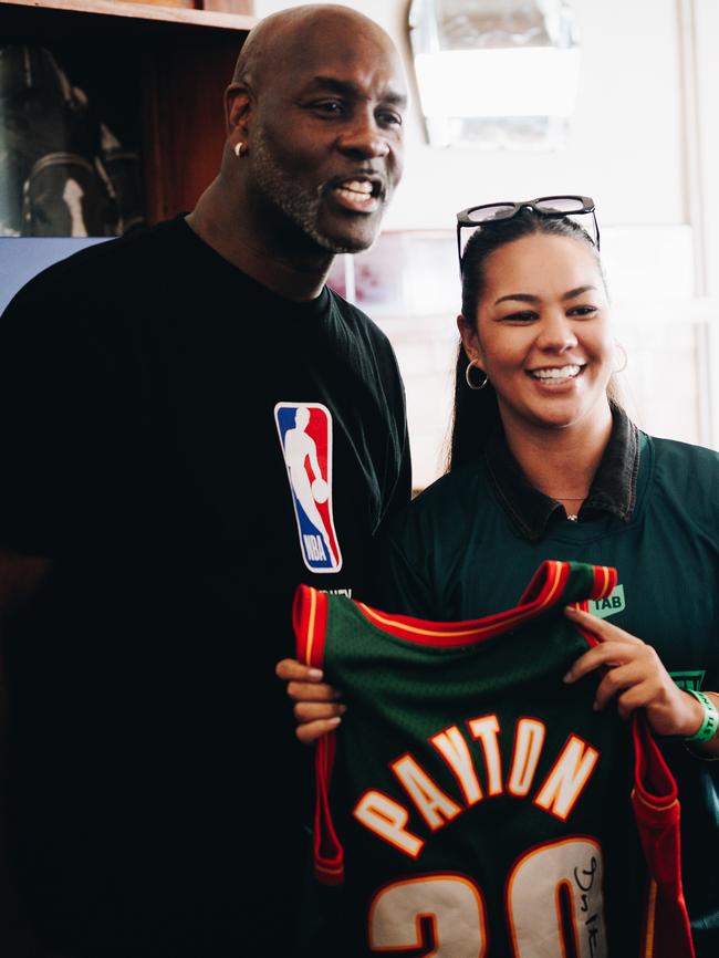 NBA legend Gary Payton with a fan at his Block Party at Magic’s Sports Bar on Manly Beach.