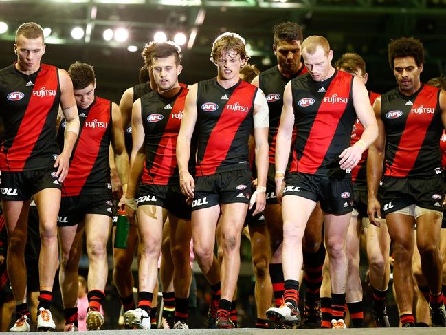 *** BESTPIX *** MELBOURNE, AUSTRALIA - JUNE 10: Bombers players leave the field at half time during the 2016 AFL Round 12 match between the Essendon Bombers and the Hawthorn Hawks at Etihad Stadium on June 10, 2016 in Melbourne, Australia. (Photo by Adam Trafford/AFL Media/Getty Images)