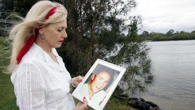 Christine Hardy holding a photo of her son Billy.