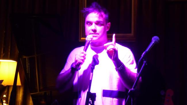 Cat man: Robbie Williams on stage at Melbourne jazz club The Paris Cat this week.