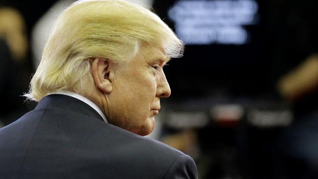 Republican presidential candidate, businessman Donald Trump pauses in the Spin Room after a Republican presidential primary debate at The University of Houston, Thursday, Feb. 25, 2016, in Houston. (AP Photo/David J. Phillip)