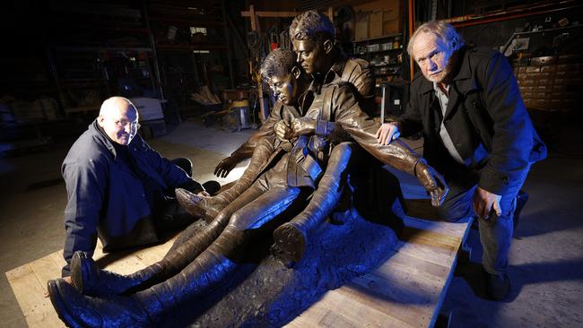 Louis Laumen and Bill Gibbins with a statue of the Hunter brothers, Diggers from World War I, cast at Fundere Foundry in Sunshine. Picture: Alex Coppel