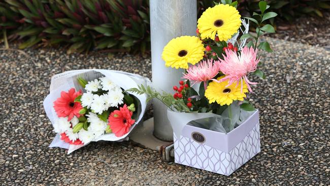 Flowers at the Deception Bay Police Station, after 53-year-old police officer David Masters was killed overnight attempting to stop a stolen car. Photo: Steve Pohlner