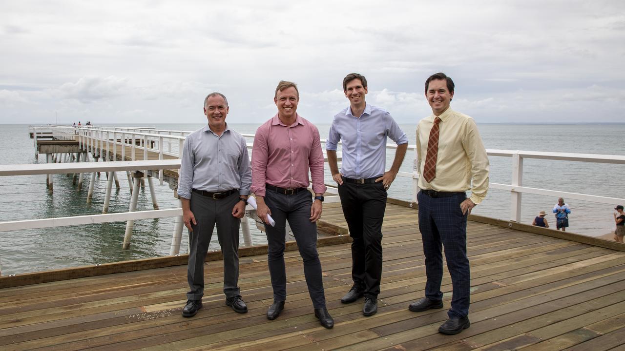 Member for Hervey Bay Adrian Tantari, Deputy Premier Steven Miles, Member for Bundaberg Tom Smith and Fraser Coast Mayor George Seymour on the newly repaired Scarness Jetty.