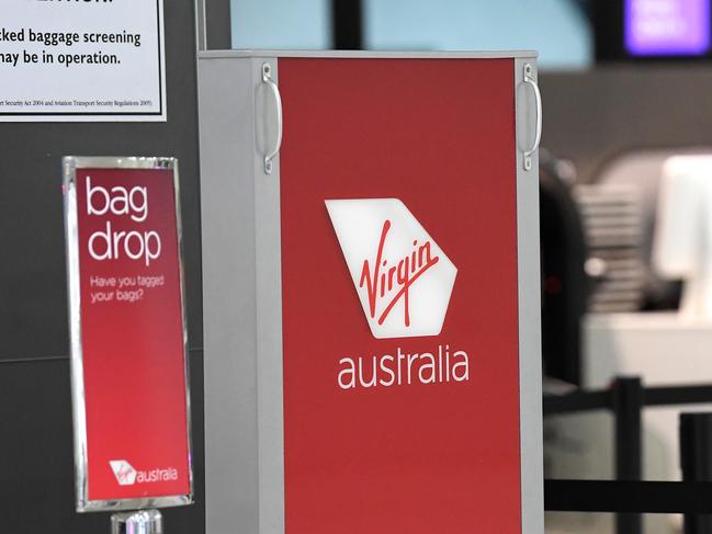 Signage for Virgin Australia is seen at Melbourne Airport in Melbourne, Monday, April 20, 2020. (AAP Image/James Ross) NO ARCHIVING