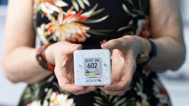 Breathe easy: Lidia Morawska with the carbon dioxide monitor she carries with her to check air quality. Picture: David Kelly.