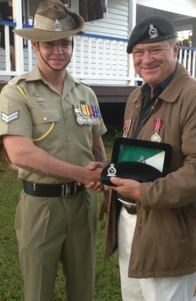 Geoff Benson (right) announces last Anzac Day Dawn Service at Queensland Country Women’s Association hall memorial in Upper Coomera. Photo: Chele Drewes