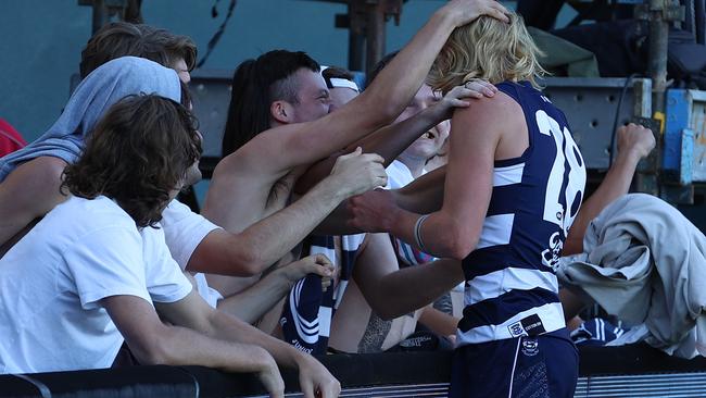 Dempsey is surrounded by his travelling fan club after his first game for Geelong. Picture: Getty Images