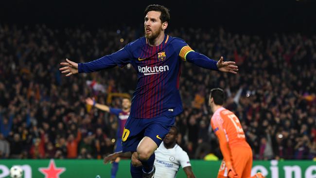 Lionel Messi of Barcelona celebrates as he scores their third goal against Chelsea.