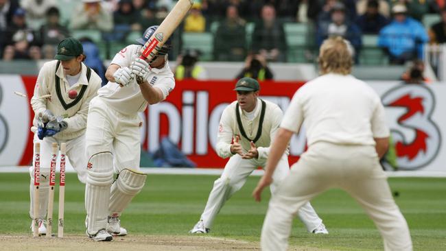 Warne bowls Strauss for his 700th wicket.