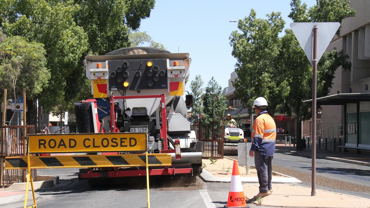 Workers resurfacing Hartley St, Alice Springs, Thursday October 10. Picture: Gera Kazakov