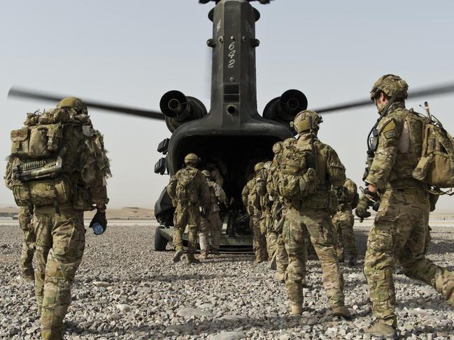 Australian Army soldiers from Special Operations Task Group and their Afghan National Security Force partners board a US Army CH-47 Chinook helicopter at Multi-National Base Tarin Kowt, Uruzgan province, southern Afghanistan, in 2012. *** Local Caption *** Australian Army soldiers from Special Operations Task Group (SOTG) are deployed to Uruzgan province in southern Afghanistan to conduct population-centric, security and counter-network operations alongside their Afghan National Security Forces partners against Taliban insurgents.   SOTG comprises personnel from the Special Air Service Regiment, 1st and 2nd Commando Regiments, Incident Response Regiment, Special Operations Logistics Squadron and a variety of supporting units from the ADF. Picture: Department of Defence