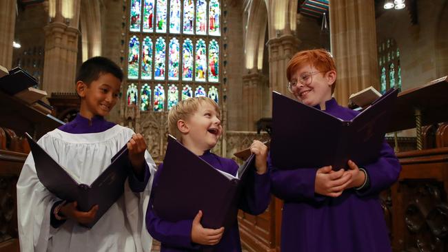 Rene Pulikkaseril, 9, Sam Cobb, 7, and Zev Mann, 9, of the St Andrew's Cathedral Choir rehearsing. Picture: Justin Lloyd