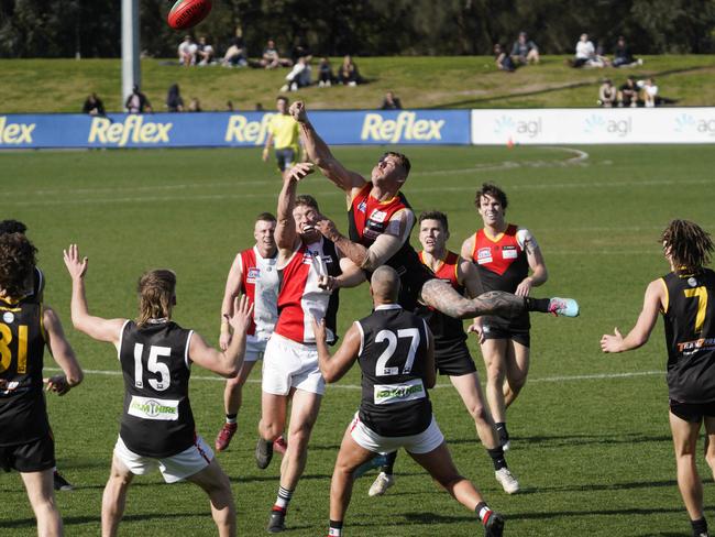 Danny Ades punches the ball. Picture: Valeriu Campan