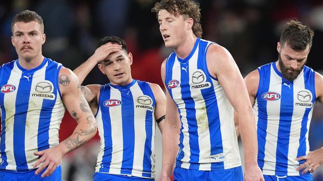 MELBOURNE, AUSTRALIA - JUNE 16: Cameron Zurhaar, Zac Fisher, Nick Larkey and Luke McDonald of the Kangaroos look dejected after the round 14 AFL match between North Melbourne Kangaroos and Collingwood Magpies at Marvel Stadium, on June 16, 2024, in Melbourne, Australia. (Photo by Daniel Pockett/Getty Images)