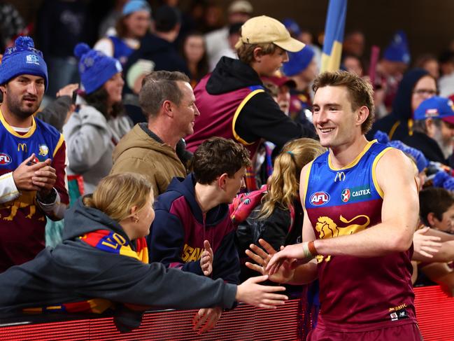 Harris Andrews celebrates with Brisbane fans after a Lions win. Picture: Chris Hyde/AFL Photos/via Getty Images