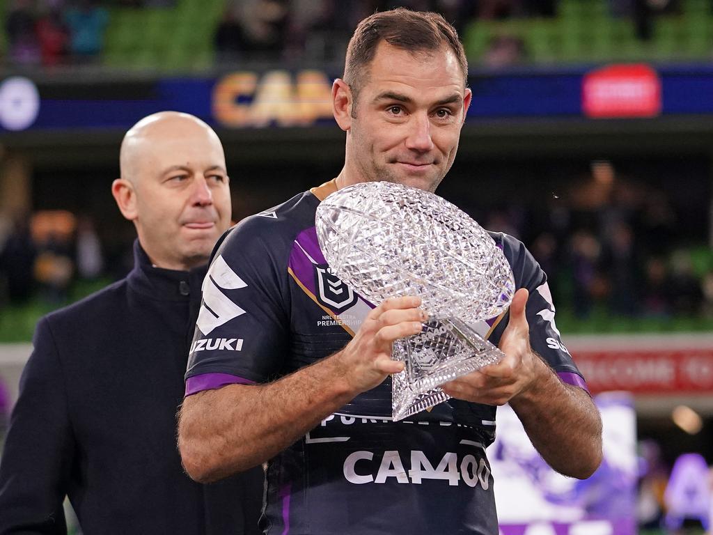 Melbourne Storm Captain Cameron Smith poses with a special custom-designed crystal football after 400 NRL games.