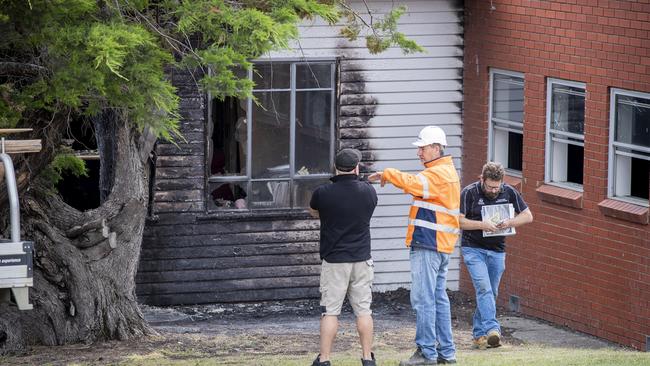 Police and fire investigators at the site of the fire at Cosgrove High School. Picture: RICHARD JUPE