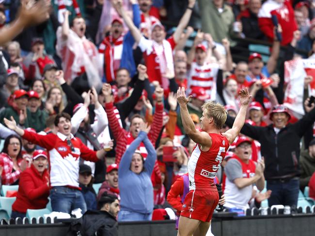 Isaac Heeney celebrates with Sydney fans. Picture: Phil Hillyard