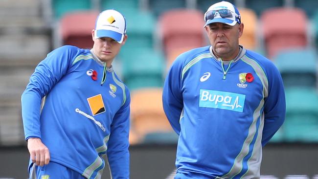 Australian captain Steve Smith and Australian coach Darren Lehmann inspect the pitch.