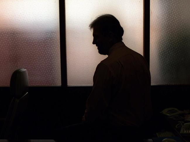 Generic image. Silhouette of a man (parent of) a sex abuse victim in an office. wrongly accused of touching young girl. Child sexual abuse. sex crime incest paedophilia.