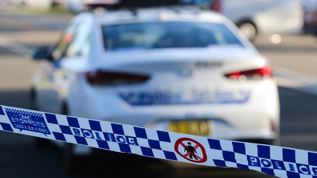 SYDNEY, AUSTRALIA - NEWSWIRE PHOTOS June 14 2022: A general stock image of a Police tape in front of a Police car in Sydney. Picture NCA Newswire/ Gaye Gerard.