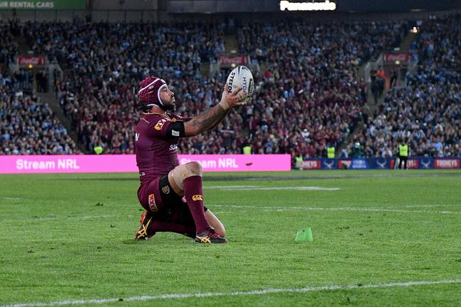 With a busted shoulder Johnathan Thurston kicks the match-winning conversion against the Blues in State of Origin II.