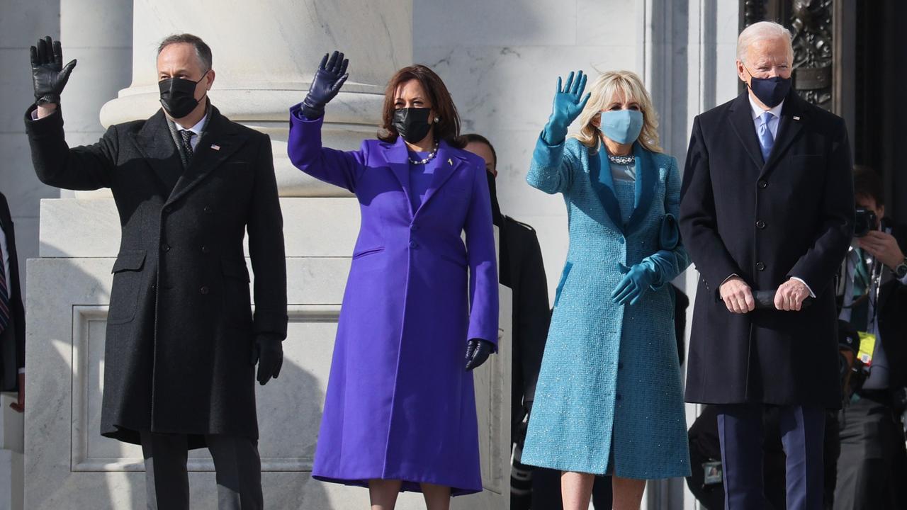 Doug Emhoff, Vice President Kamala Harris, Jill Biden and President Joe Biden wave as they arrive on the East Front of the Capitol for the inauguration. Picture: AFP