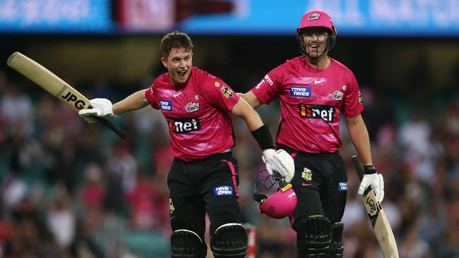 Hayden Kerr celebrates hitting the winning runs with Jay Lenton of the Sixers during the BBL match against the Adelaide Strikers.