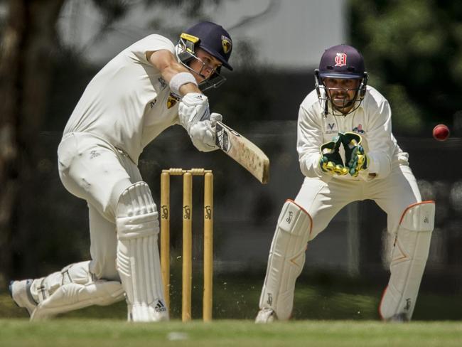 Dandenong wicketkeeper Jacques Augustin up to the stumps and sweating on a snick.