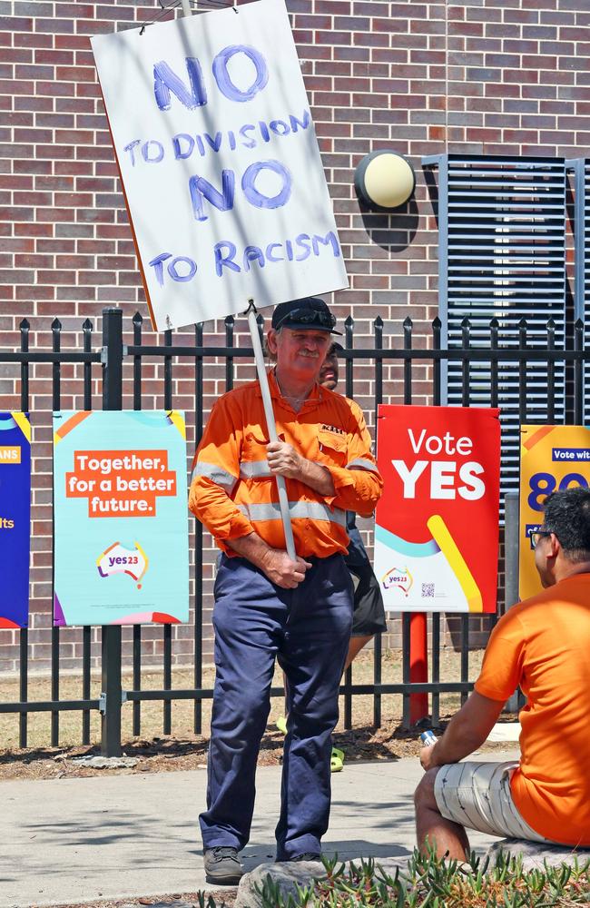 A protester waves a sign at the St Frances Xavier school in Goodna, QLD. Picture: Tertius Pickard