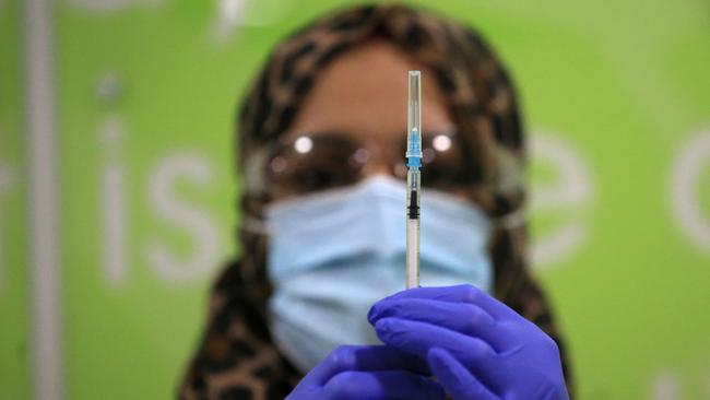 A health worker prepares a coronavirus vaccine at a pop-up Covid-19 vaccination clinic in the UK. Picture: Lindsey Parnaby/AFPs