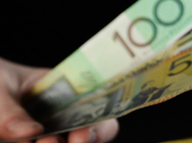 Australian dollar banknotes of various denominations are counted in an arranged photograph in Melbourne, Australia, on Saturday, Aug. 17, 2013. Australia’s dollar rose to a three-week high on speculation minutes tomorrow of the Reserve Bank’s meeting this month will signal the central bank is in no hurry to cut interest rates. Photographer: Carla Gottgens/Bloomberg