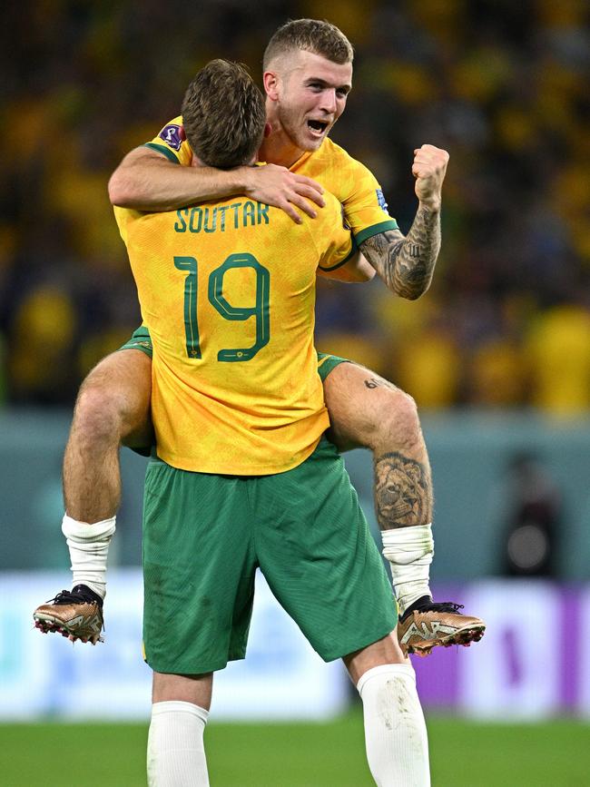 Riley McGree and Harry Souttar celebrate Australia’s win over Denmark. Picture: Getty Images