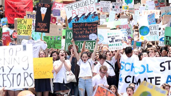 SYDNEY, AUSTRALIA - NOVEMBER 30: Students gather to demand the government take action on climate change at Martin Place on November 30, 2018 in Sydney, Australia. Inspired by Greta Thunberg, a 15-year-old Swedish student who led a strike outside Swedish parliament, thousands of students are expected to walk out of school today in cities across Australia to demand government action on climate change. Prime Minister Scott Morrison urged students to stay in school, telling parliament, "what we want is more learning in schools and less activism in schools".  (Photo by Mark Metcalfe/Getty Images)