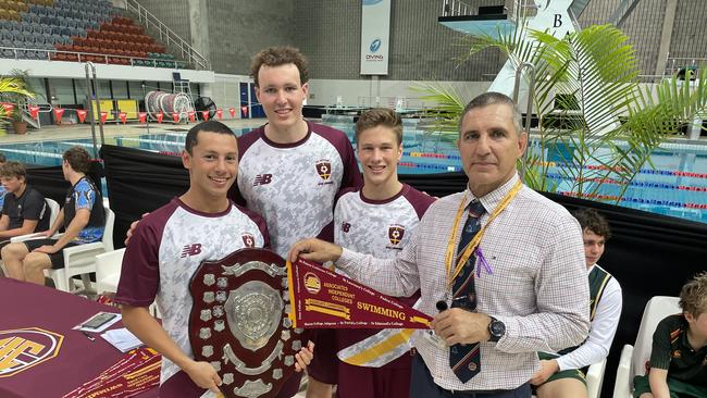 St Peters Lutheran College swimmers captains Nick Nankervis, Josh Staples and Rob Thorpe with AIC's Peter Elmore.