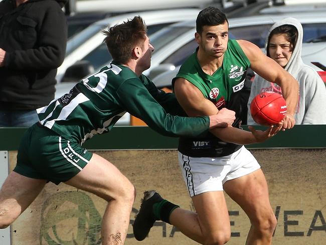 Patrick Baccari of Greenvale (right) under pressure from Jason Denny of Airport West during EDFL footy: Airport West v Greenvale on Saturday, August 10, 2019, in Reservoir, Victoria, Australia. Picture: Hamish Blair