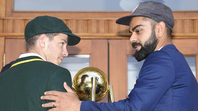 Kohli with Australian counterpart Tim Paine pose with the Border-Gavaskar trophy in Adelaide. Pic: AAP