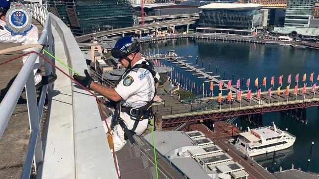 Strike Force Officers also had specialist police abseil down the outside of the building.