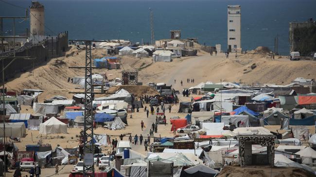People walk in a camp for displaced people in Rafah in the southern Gaza Strip by the border with Egypt on April 28, 2024, amid the ongoing conflict between Israel and the Palestinian militant group Hamas. Picture: AFP