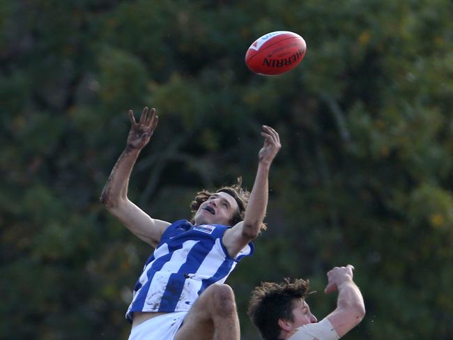 Nick Knoops flies for the ball. Picture: Stuart Milligan