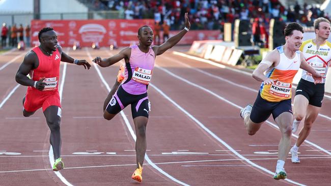 Lachlan Kennedy, second right, crosses the finish line ahead of South Africa's Bayanda Walaza and Kenya's Ferdinand Omanyala. Picture: AFP