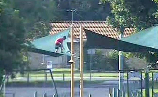 A youth is captured on CCTV climbing on shade sails at Lenihan Park, Rosewood. . Picture: Contributed