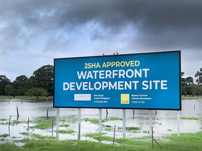 A proposed new housing estate at Carrara on the Robina Parkway is flooded after heavy torrential rain fell on the city overnight causing localised flash flooding. NCA NewsWire / Scott Powick