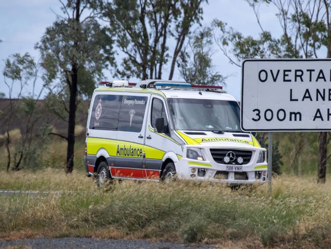 Ambulance leaves the scene of fatal crash involving car and truck on Warrego Highway between Bowenville and Dalby. Sunday, January 30, 2022. Picture: Nev Madsen.