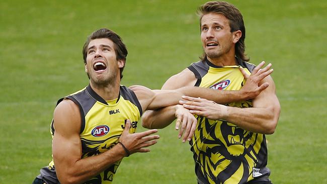 Ivan Maric (right) wrestles with Alex Rance in preparation for his comeback game. Picture: Colleen Petch