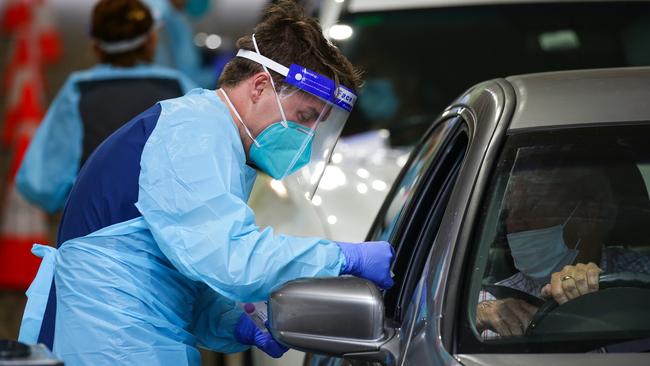 Nurses testing locals at the Warringah Aquatic Centre Pop-up Drive-through COVID-19 Testing site. Picture: NCA NewsWire / Gaye Gerard