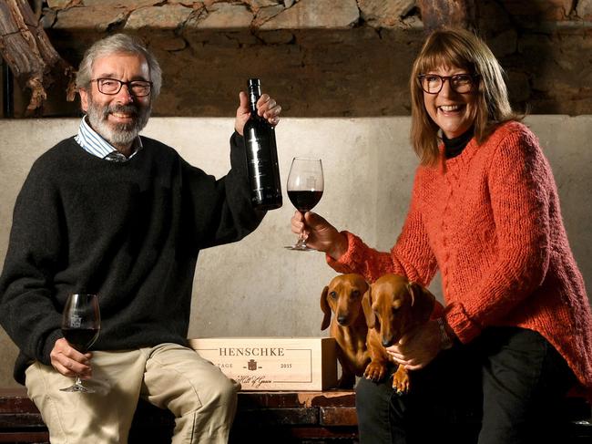 Stephen and Prue Henschke with the 2015 Hill of Grace pictured at their cellar door with dogs Lotti and Fritzwilly. STORY: Henschke Winners in Eden Valley faced bushfires, a challenging vintage and now the temporary closure of their cellar door due to COVID-19 but there's reason to celebrate. The release of their 2015 Hill Of Grace is a triumph Picture: Tricia Watkinson