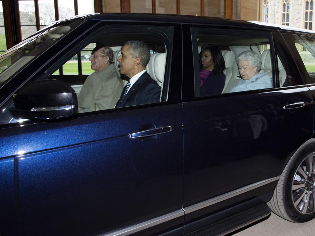 Prince Philip drives the Queen, former US President Barack Obama and former First Lady Michelle Obama in April 22, 2016. Picture: Getty